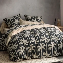 BecquetDrap plat coton noir charbon à motif tropical beige - TOURISME