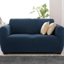 BecquetHousse de canapé bi-extensible bleue unie - CORA BI