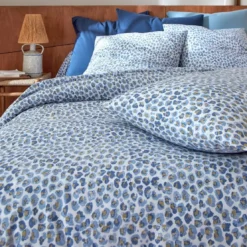 BecquetHousse de couette en coton blanc à motif léopard bleu et doré - SAFARI