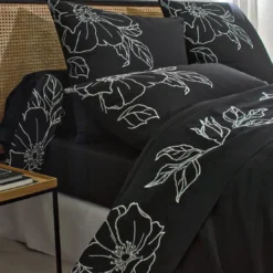 BecquetTaie de traversin en percale de coton noir à fleurs brodées - SUZON