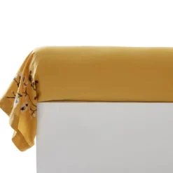 BecquetTaie de traversin en percale de coton jaune ocre à motif brodée - ILE SACREE