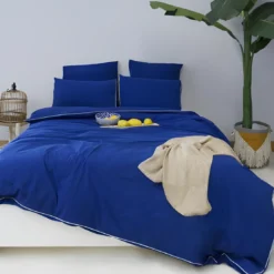 L'Officiel InteriorsLes signatures - Housse de couette en percale de coton - Bleu marine/passepoil blanc